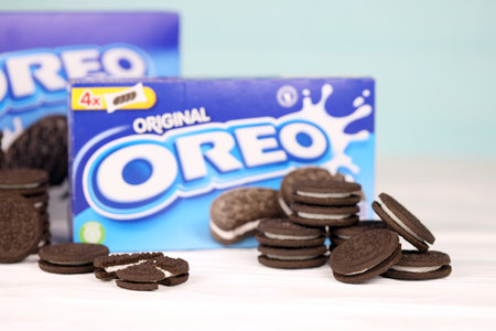 KHARKOV, UKRAINE - NOVEMBER 24, 2020: Oreo sandwich cookies and blue product boxes on white table. Oreo is a sandwich cookie with a sweet cream is the best selling cookie in the USのeditorial素材