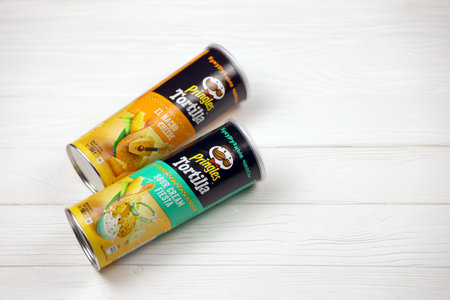 KHARKOV, UKRAINE - NOVEMBER 23, 2020: Pringles cylinder tubes with Tortilla el nacho cheese and sour...