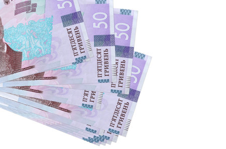 50 Ukrainian hryvnias bills lies in small bunch or pack isolated on white. Mockup with copy space....