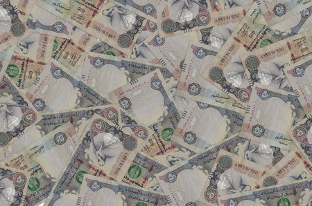 50 UAE dirhams bills lies in big pile. Rich life conceptual background. Big amount of money