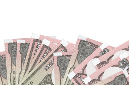 1 Indian rupee bills lies on bottom side of screen isolated on white background with copy space....