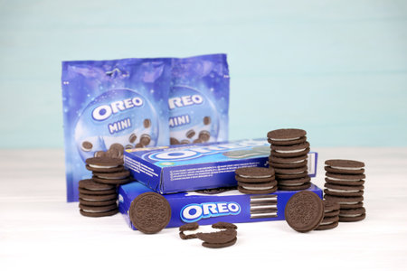 KHARKOV, UKRAINE - NOVEMBER 24, 2020: Oreo sandwich cookies and blue product boxes on white table....