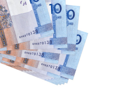 10 Belorussian rubles bills lies in small bunch or pack isolated on white. Mockup with copy space....