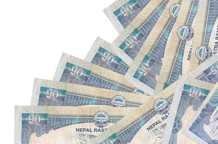 50 Nepalese rupees bills lies in different order isolated on white. Local banking or money making concept. Business background bannerの写真素材