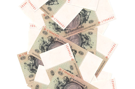 50 Reich marks bills flying down isolated on white. Many banknotes falling with white copy space on...
