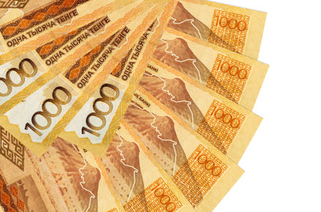 1000 Kazakhstani tenge bills lies isolated on white background with copy space stacked in fan shape...