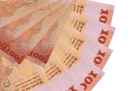 100 Sri Lankan rupees bills lies isolated on white background with copy space stacked in fan shape...