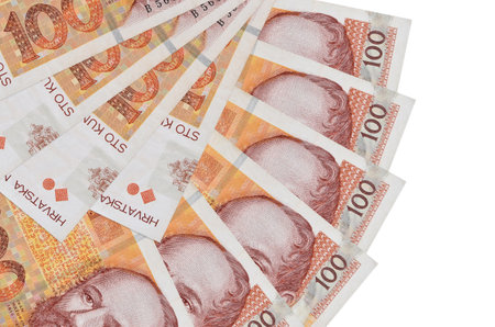 100 Croatian kuna bills lies isolated on white background with copy space stacked in fan shape close...
