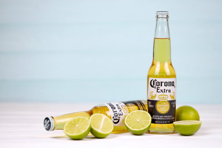 KHARKOV, UKRAINE - DECEMBER 9, 2020: Bottles of Corona Extra Beer with lime slices. Corona produced by Grupo Modelo with Anheuser Busch InBev is the most popular imported beer in the USのeditorial素材