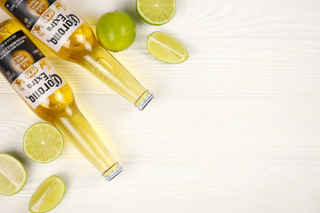 KHARKOV, UKRAINE - DECEMBER 9, 2020: Bottles of Corona Extra Beer with lime slices. Corona produced by Grupo Modelo with Anheuser Busch InBev is the most popular imported beer in the USのeditorial素材