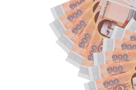 100 Cambodian riels bills lies isolated on white background with copy space. Rich life conceptual...