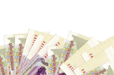 100 Cambodian riels bills lies on bottom side of screen isolated on white background with copy space. Background banner template for business concepts with moneyの写真素材