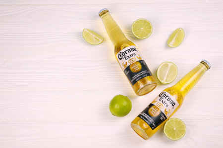 KHARKOV, UKRAINE - DECEMBER 9, 2020: Bottles of Corona Extra Beer with lime slices. Corona produced by Grupo Modelo with Anheuser Busch InBev is the most popular imported beer in the USのeditorial素材