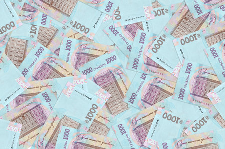 1000 Ukrainian hryvnias bills lies in big pile. Rich life conceptual background. Big amount of money