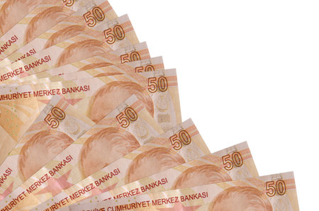 50 Turkish liras bills lies isolated on white background with copy space stacked in fan close up....