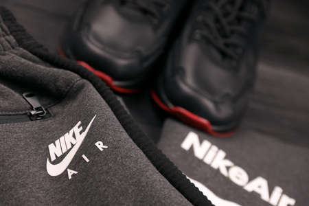 KHARKOV, UKRAINE - DECEMBER 20, 2020: Nike brand clothes and shoes sportwear kit. Nike is American multinational corporation engaged in manufacturing and worldwide marketing of clothes and footwearのeditorial素材