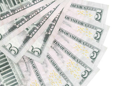 5 US dollars bills lies isolated on white background with copy space stacked in fan shape close up. Financial transactions conceptの写真素材