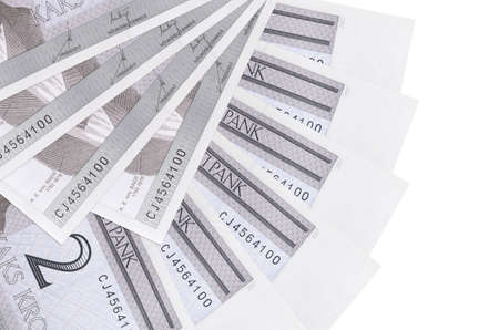2 Estonian kroon bills lies isolated on white background with copy space stacked in fan shape close...