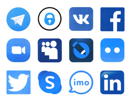 KHARKOV, UKRAINE - FEBRUARY 24, 2021: Many icons of popular social networks and messengers printed on white paper. Logos of modern communication portals and smartphone apps.のeditorial素材