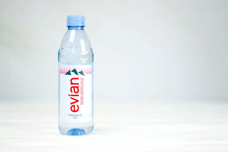 KHARKOV, UKRAINE - JULY 2, 2021: Bottle Of Evian Natural Mineral Water. Evian bottling factory...