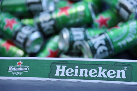 KHARKOV, UKRAINE - JULY 31, 2021: Green tin cans of Heineken pale lager beer produced by the Dutch brewing company Heineken NVのeditorial素材