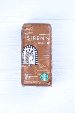 KHARKOV, UKRAINE - MARCH 15, 2021: Starbucks coffee pack with green logo. Starbucks Corporation is a...