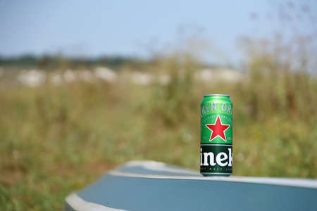 KHARKOV, UKRAINE - JULY 31, 2021: Green tin can of Heineken pale lager beer produced by the Dutch brewing company Heineken NVのeditorial素材