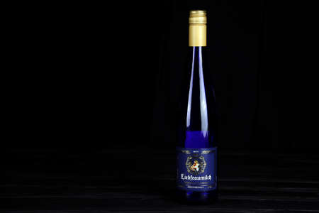 KHARKOV, UKRAINE - DECEMBER 3, 2020: St.Ursula Liebfraumilch Rheinhessen wine bottle on dark black background. Elite alcohol productionのeditorial素材