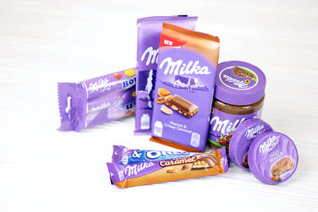 KHARKOV, UKRAINE - JULY 2, 2021: Milka chocolate products with classical lilac color wrapping design...