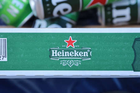 KHARKOV, UKRAINE - JULY 31, 2021: Green tin cans of Heineken pale lager beer produced by the Dutch brewing company Heineken NVのeditorial素材