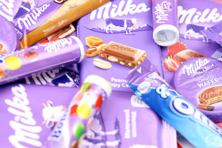 KHARKOV, UKRAINE - JULY 2, 2021: Milka chocolate products with classical lilac color wrapping design...