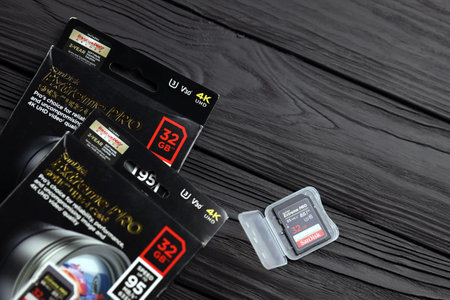 KHARKOV, UKRAINE - JANUARY 12, 2021: SanDisk Extreme pro sdhc 32gb new memory card for photo cameras and video recording devicesのeditorial素材