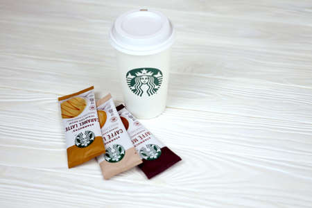 KHARKOV, UKRAINE - JULY 2, 2021: Starbucks coffee sticks with green . Starbucks Corporation is multinational chain of coffeehouses and roastery reserves headquartered in Seattle, Washingtonのeditorial素材