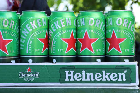 KHARKOV, UKRAINE - JULY 31, 2021: Green tin cans of Heineken pale lager beer produced by the Dutch brewing company Heineken NVのeditorial素材
