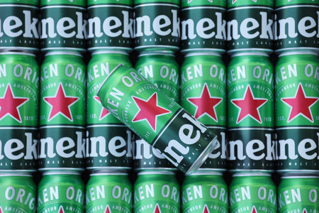 KHARKOV, UKRAINE - JULY 31, 2021: Green tin cans of Heineken pale lager beer produced by the Dutch brewing company Heineken NVのeditorial素材