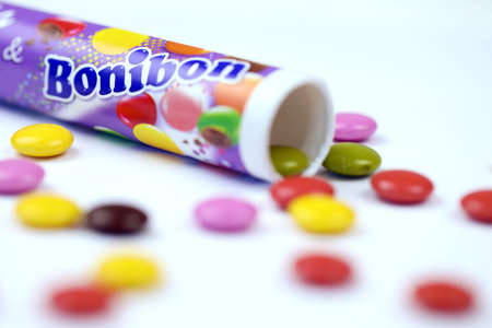 KHARKOV, UKRAINE - JULY 2, 2021: Bonibon Milka chocolate candies with classical lilac color wrapping design on white wooden tableのeditorial素材