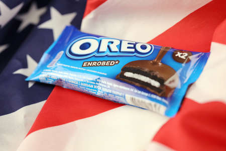 KHARKIV, UKRAINE - DECEMBER 16, 2021: Oreo enrobed chocolate snack cookies in wrapping with logo....