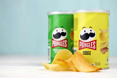 KHARKIV, UKRAINE - DECEMBER 16, 2021: Pringles production with new logo. Pringles is a brand of potato snack chips owned by the Kellogg Companyのeditorial素材