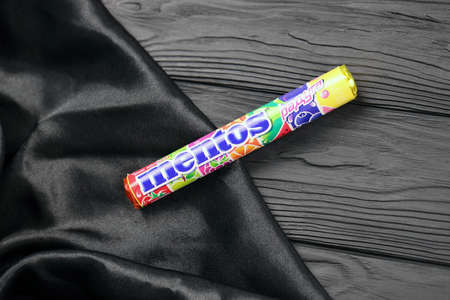 KHARKIV, UKRAINE - DECEMBER 16, 2021: Mentos production with company logo. Mentos fruity chewy dragees - produced by Perfetty Van Melle Netherlands corporationのeditorial素材
