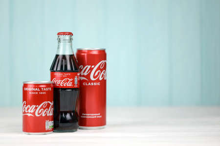 KHARKIV, UKRAINE - DECEMBER 16, 2021: Coca Cola production with classic company logo. Coca-Cola is a famous carbonated soft drink sold in stores, throughout the world.のeditorial素材