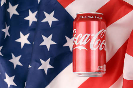 KHARKIV, UKRAINE - DECEMBER 16, 2021: Coca Cola production with classic company logo. Coca-Cola is a famous carbonated soft drink sold in stores, throughout the world.のeditorial素材