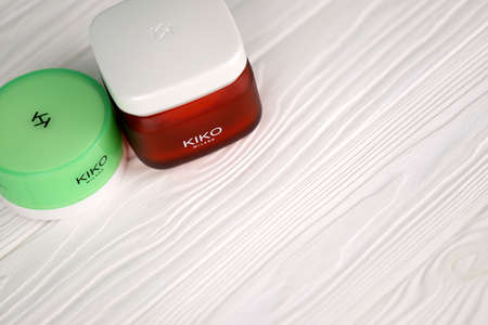 KHARKIV, UKRAINE - DECEMBER 16, 2021: Kiko Milano cream jars with company logo. Kiko Milano is a...