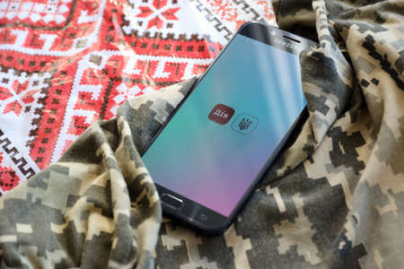 TERNOPIL, UKRAINE - APRIL 24, 2022: Diia app on smartphone screen. Diya is a mobile application with web portal and a brand of e-governance in Ukraine for citizensのeditorial素材