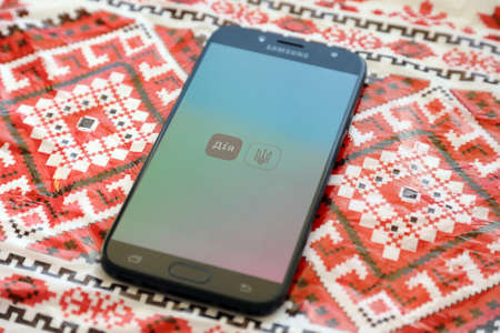TERNOPIL, UKRAINE - APRIL 24, 2022: Diia app on smartphone screen. Diya is a mobile application with web portal and a brand of e-governance in Ukraine for citizensのeditorial素材