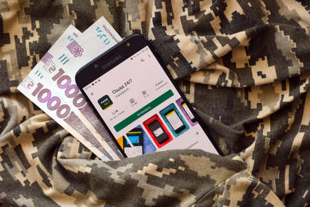 TERNOPIL, UKRAINE - APRIL 24, 2022: Oschadbank banking application on smartphone screen. Oschadbank is an important commercial bank in Ukraineのeditorial素材