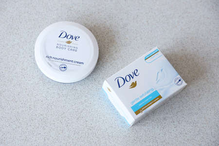 TERNOPIL, UKRAINE - APRIL 29, 2022: Production with Dove Logo on white textured surface