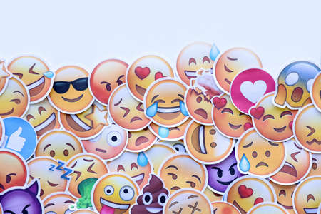 TERNOPIL, UKRAINE - APRIL 29, 2022: Large set of stickers with Emoji yellow faces. Emoji is a pictogram or smiley embedded in text and used in electronic messages and web pagesのeditorial素材