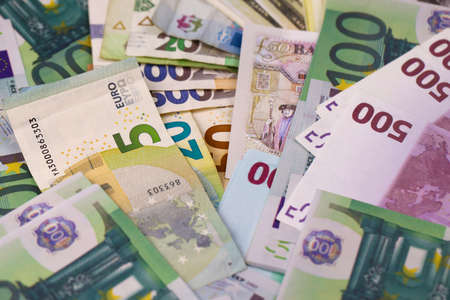 Euro and dollar money bills and coins close up. Big amount of money on table. business and stock...