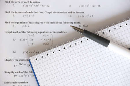 Handwriting of mathematics quadratic equation on examination, practice, quiz or test in maths class....