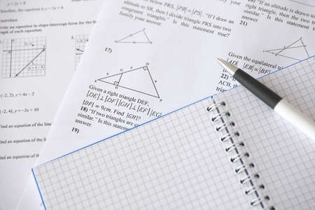 Handwriting of geometrical tasks on examination, practice, quiz or test in geometry class. Solving...